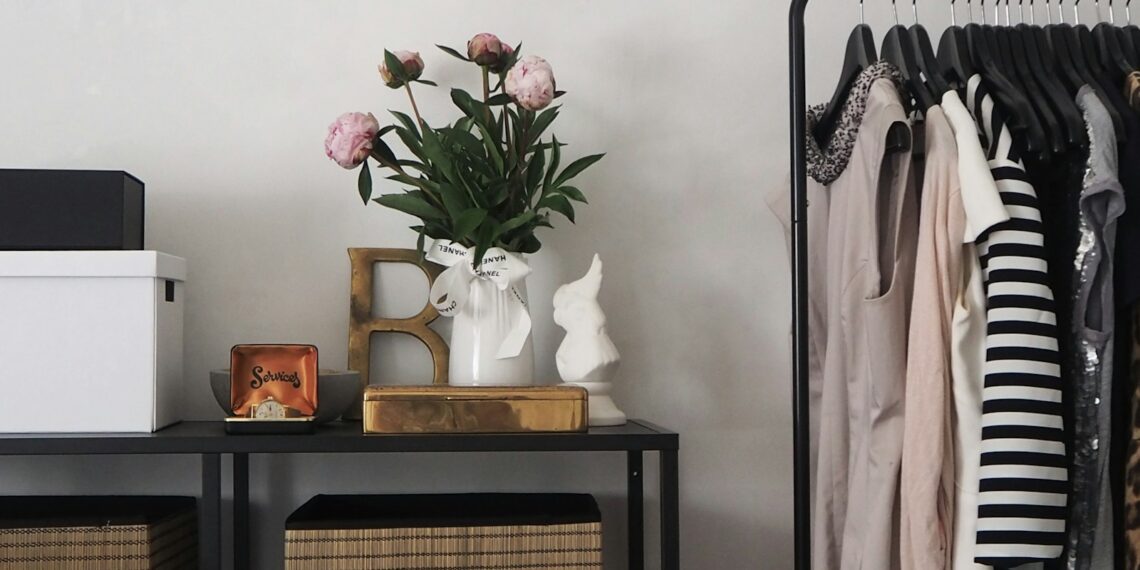 pink flowers in white vase on table